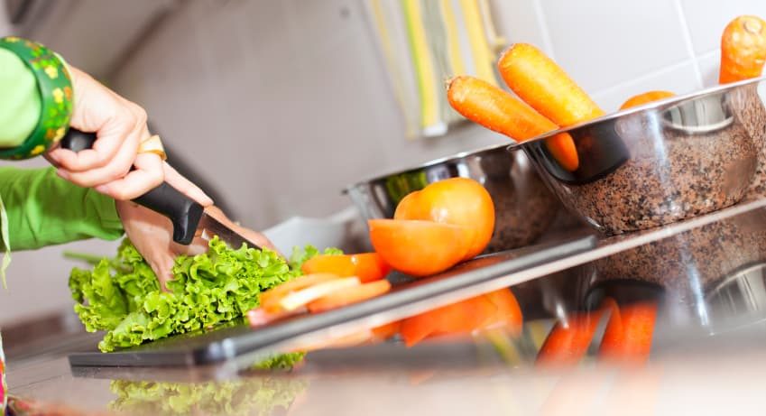 Cutting-Vegetables-In-Kitchen
